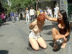 Dominant couple disgracing redhead in public